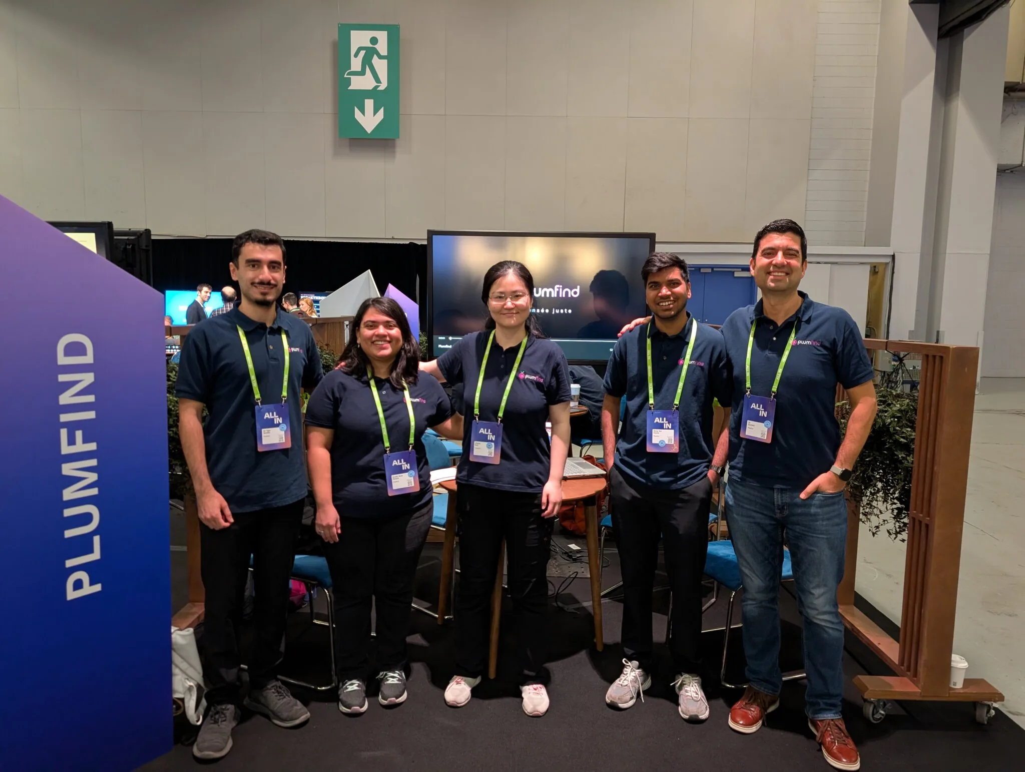 Plumfind team members collaborating at an industry event.